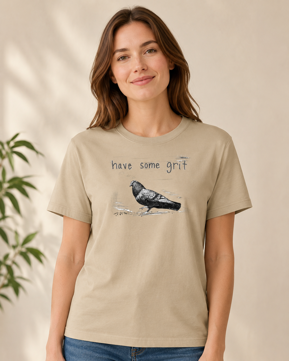 a woman wearing a tee by Gen122 with a vintage pigeon sketch and text "have some grit"