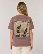 Woman wearing unisex organic cotton War Pigeons collector edition tee by Gen122 with original antique newspaper clippings and heroic quotes design on the back 
